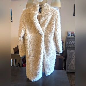 Cream colored faux fur coat